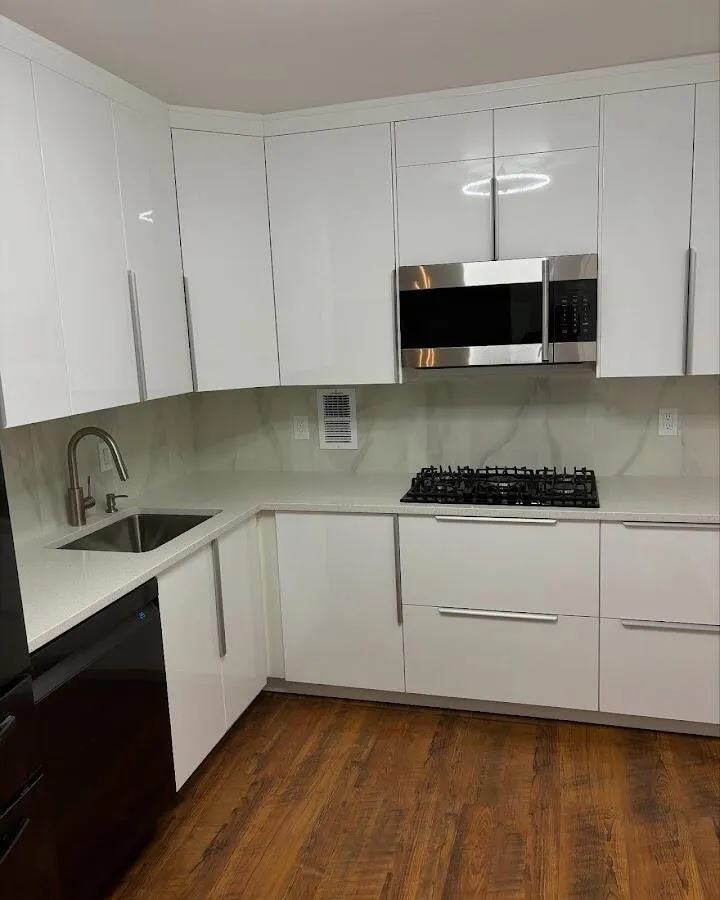 Restored kitchen with white cabinets after water damage in Kimball